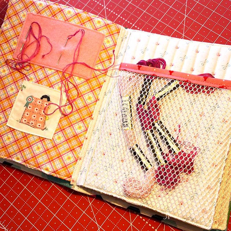 Said With Love Floss Book pink pages with thread in the mesh pocket and needles in the felt